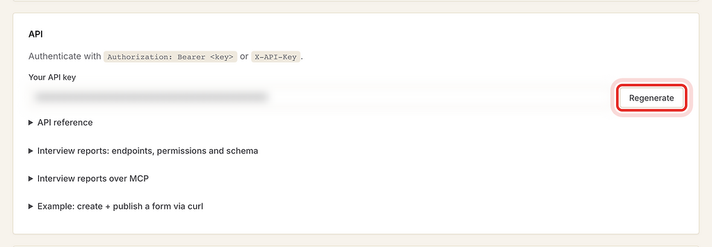Regenerate button next to the blurred API key, highlighted with a red ring.