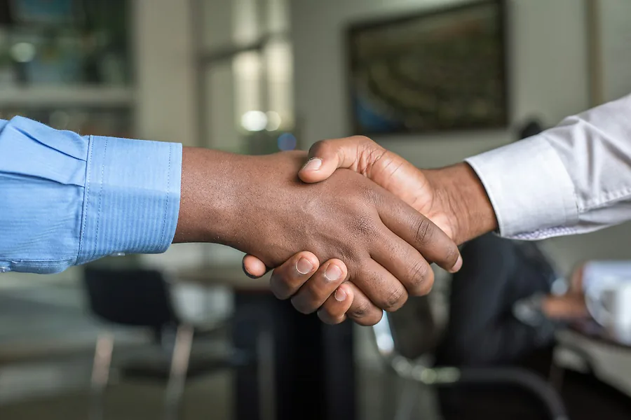 Counsel shaking hands with a client