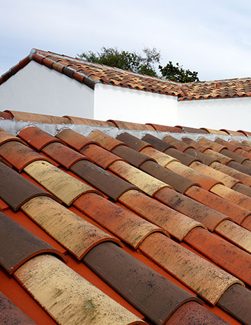 Multi-colored clay roof tiles on a sunny day