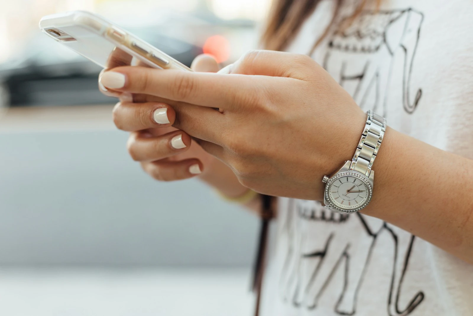 Woman typing a personal message on her phone