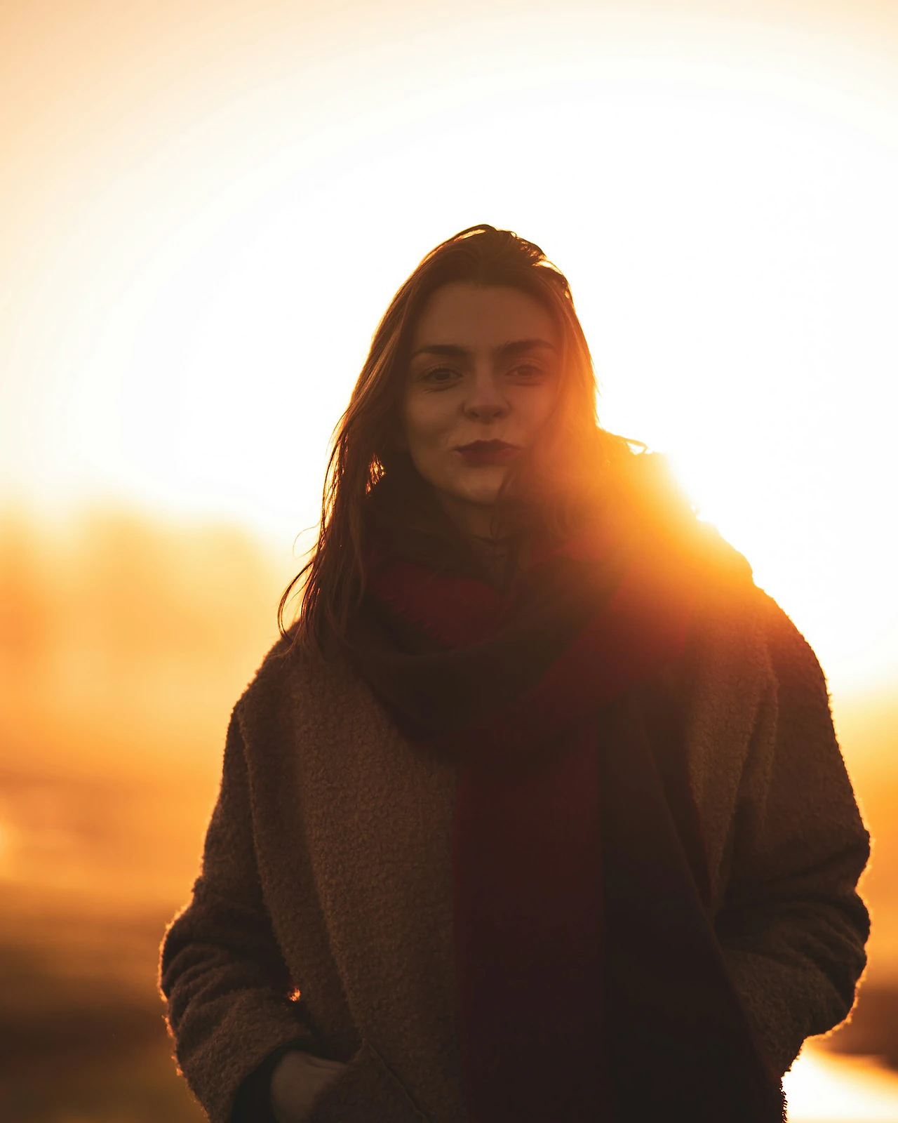 Backlit portrait of a woman in warm golden hour light