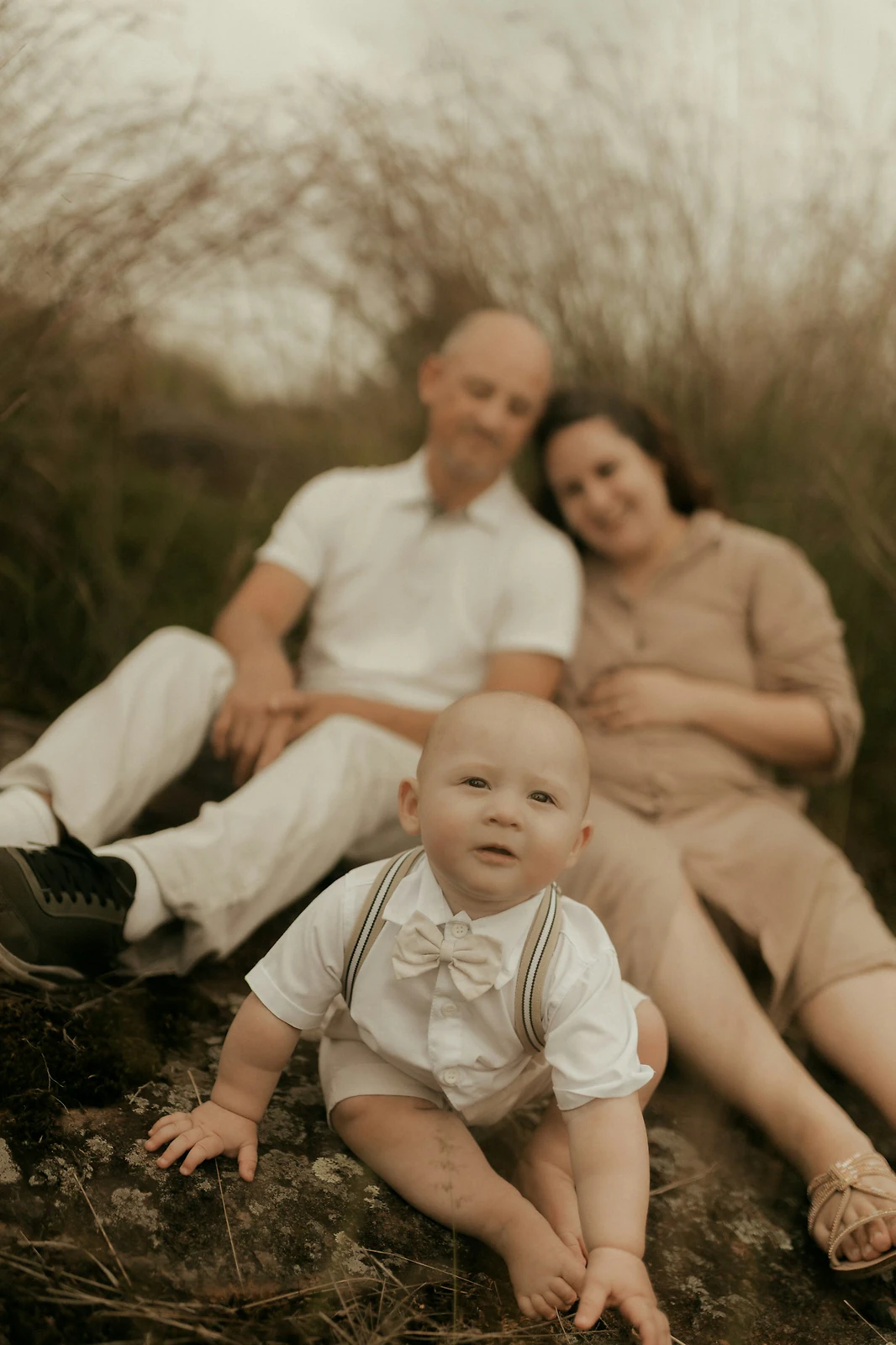 Parents with their baby during an outdoor family photo session