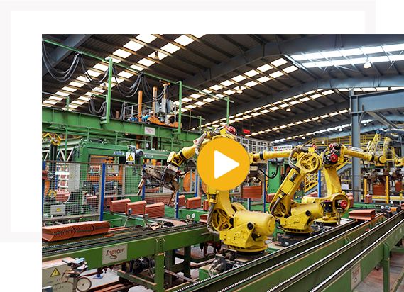 Robotic arms operating in a modern clay tile manufacturing facility.